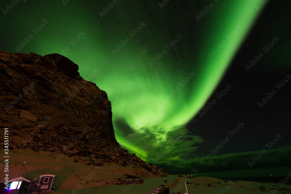 North green lighting of aurora over the mountains in Lofoten island Norway