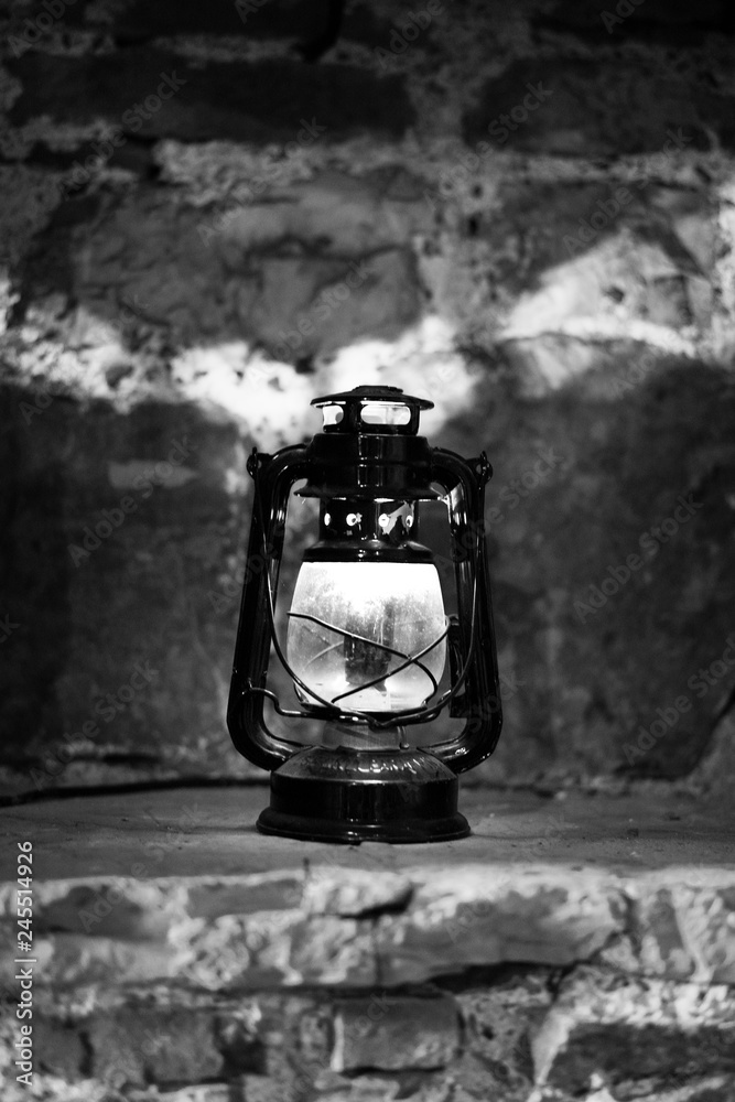 old oil lamp lantern on the wall