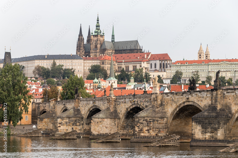 The Charles Bridge spans the river under the eye of Prague Castle