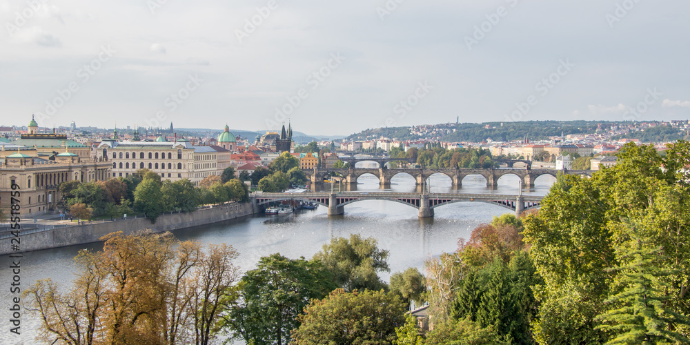 Panorama image of the Old Town pier architecture and Charles Bridge over Vltava river in Prague, Czech Republic