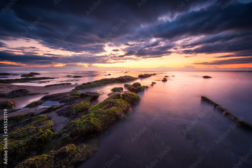 Sea sunrise at rocky beach / Amazing view with rocky beach seascape at sunrise