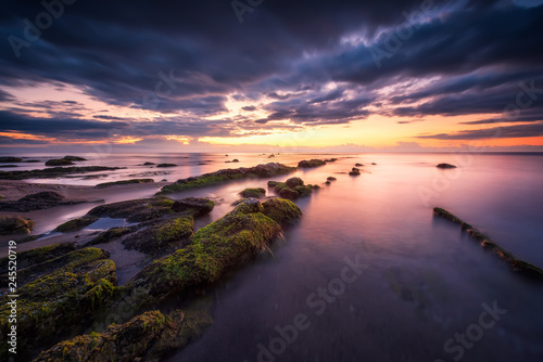 Sea sunrise at rocky beach   Amazing view with rocky beach seascape at sunrise