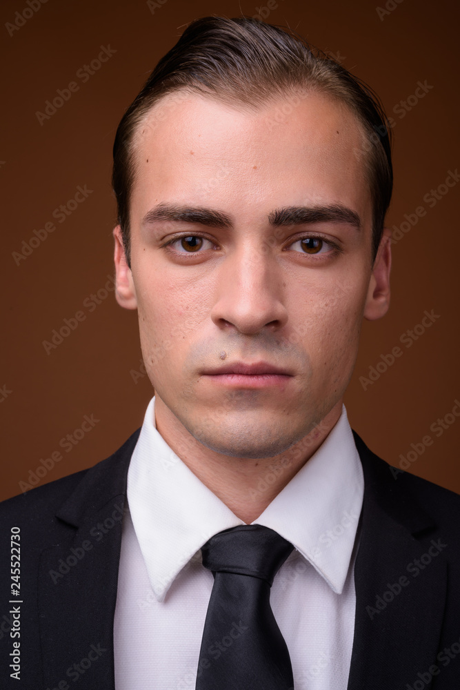 Face of young Caucasian businessman wearing suit Face of young Caucasian businessman wearing suit