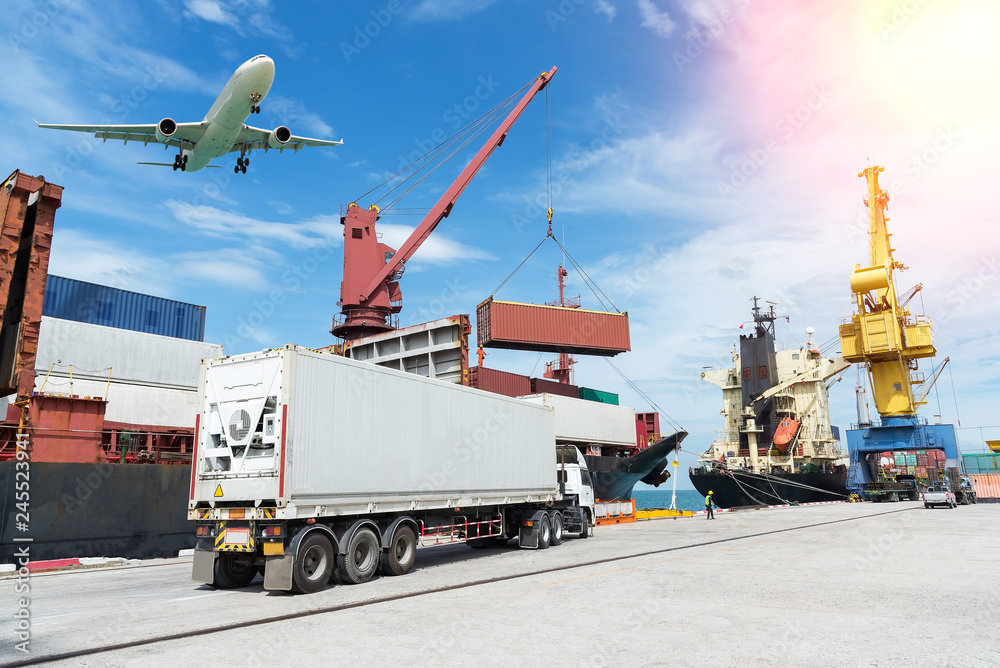 container,container ship in import export and business logistic.By crane , Trade Port , Shipping.Tugboat assisting cargo to harbor.
