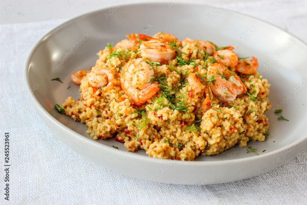 Grits cous cous with vegetables and grilled shrimp