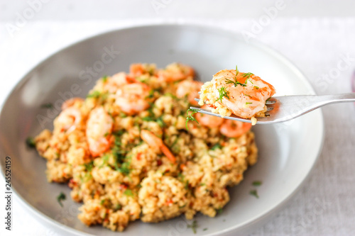 Grits cous cous with vegetables and grilled shrimp