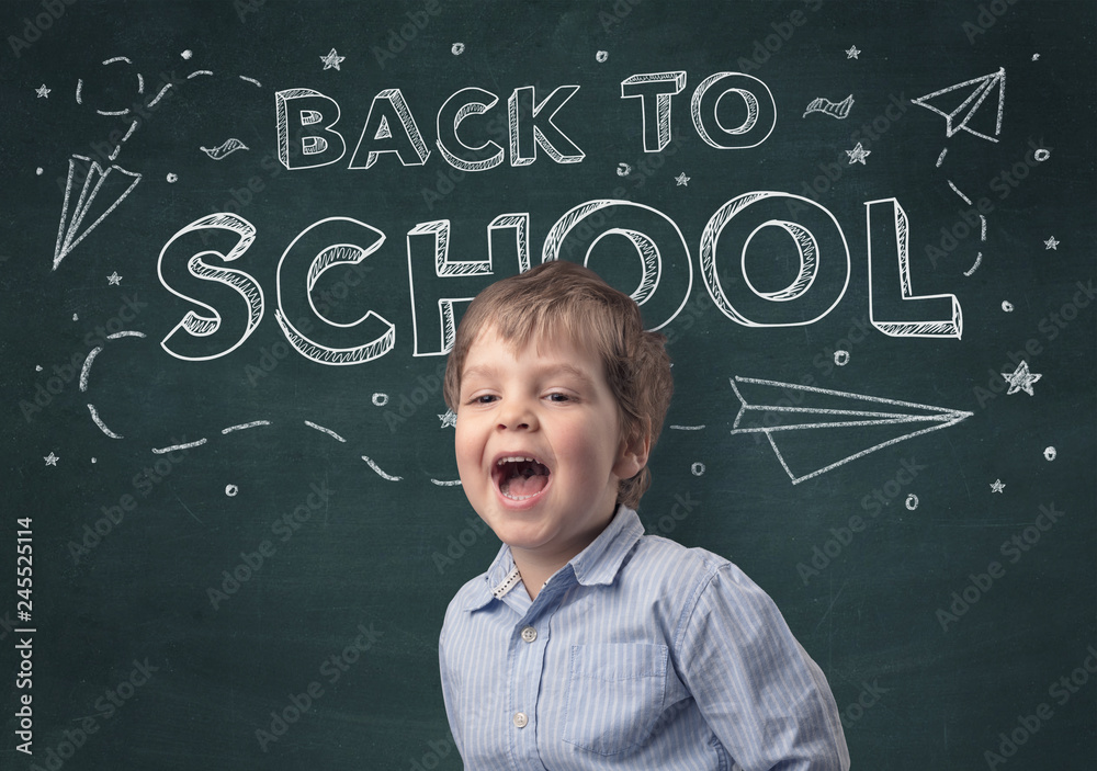 Adorable little boy with blackboard and back to school concept Adorable little boy with blackboard and back to school concept