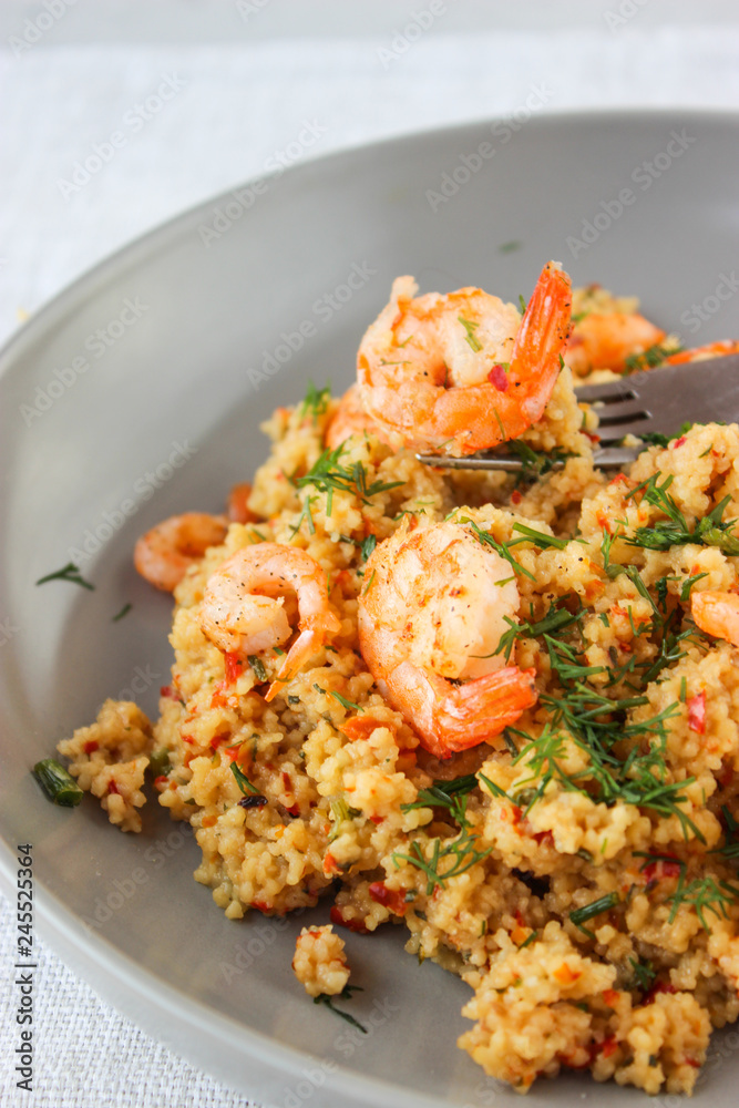 Grits cous cous with vegetables and grilled shrimp Grits cous cous with vegetables and grilled shrimp