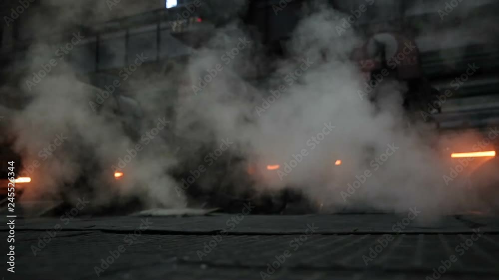 Metallurgical production. Shop. Smoke and hot steel around. Metallurgical production. Shop. Smoke and hot steel around.