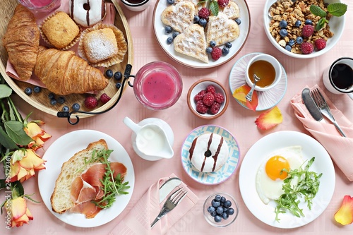 
    Brunch. Festive family breakfast set for Valentines day, Mothers day or Easter. Pink background