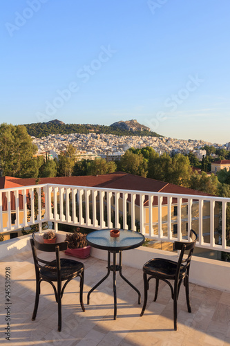 Top view from the terrace on Athens, Greece. Balcony with table and chairs