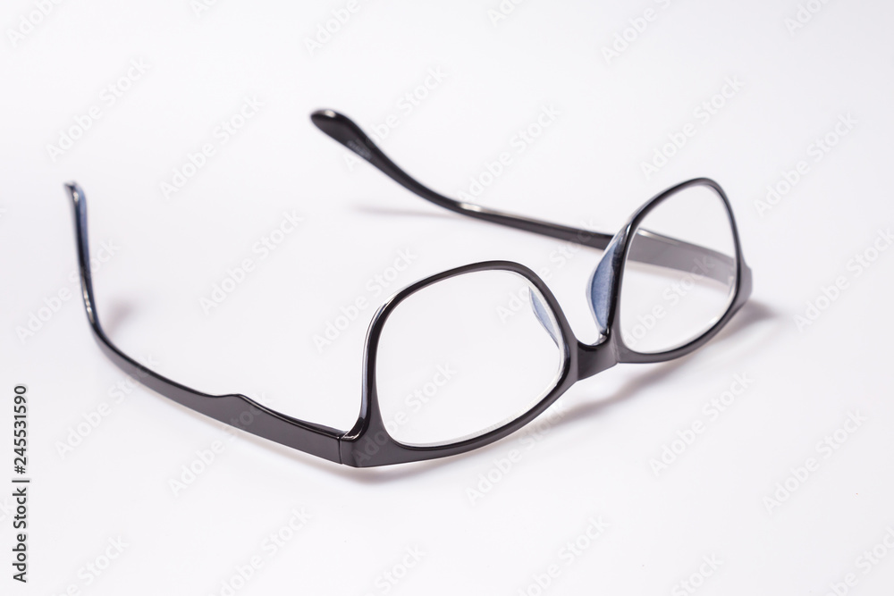 Black eye glasses spectacles with shiny black frame For reading daily life To a person with visual impairment isolaged on white background. Black eye glasses spectacles with shiny black frame For reading daily life To a person with visual impairment isolaged on white background.