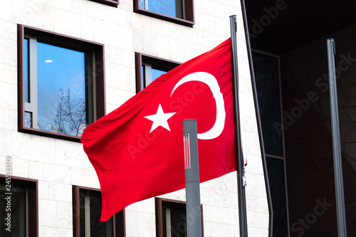 Turkish Flag waving outside the Embassy of Turkey in Berlin, Germany photo