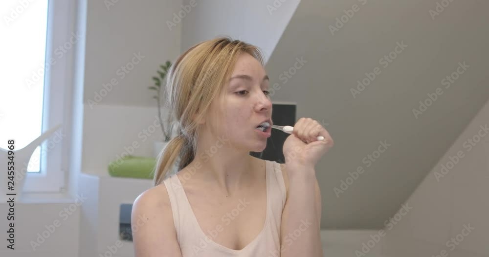 Woman brushing teeth