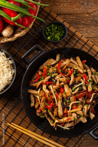 Pork chop with peppers, mushrooms and bamboo. Served with rice.