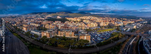 Aerial panorama view of Castelldefels, popular Costa Brava Spanish beach town with modern buildings and hilltop medieval castle near Barcelona photo