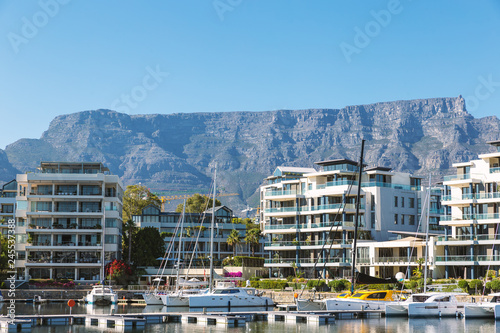 Luxury apartment buildings and yachts and Table Mountain view in Cape Town