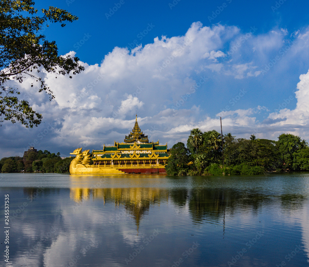 view of Kandawgyi Lake with golden  Dragon Boat building 