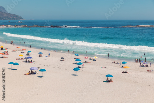 Camps bay beautiful beach with turquoise water and mountains in Cape Town, South Africa © Dmitrii