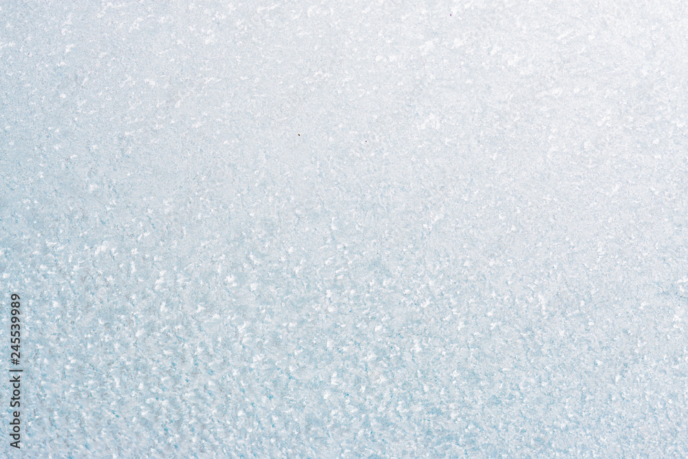 Obraz premium Frozen winter abstract background on the window glass with copy space