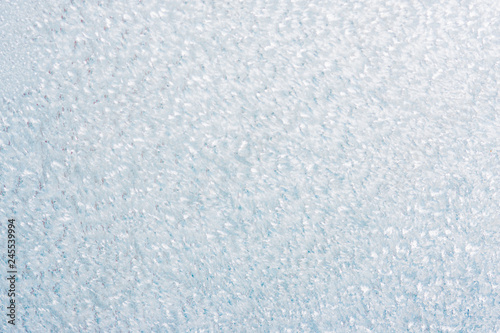 Frozen winter abstract background on the window glass with copy space