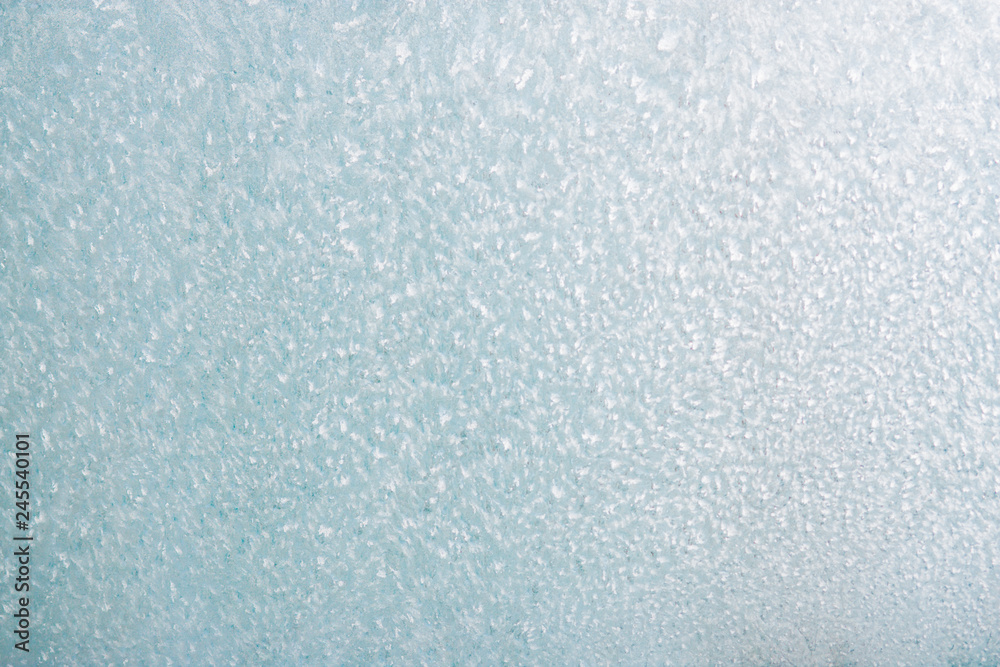 Frozen winter abstract background on the window glass with copy space Frozen winter abstract background on the window glass with copy space