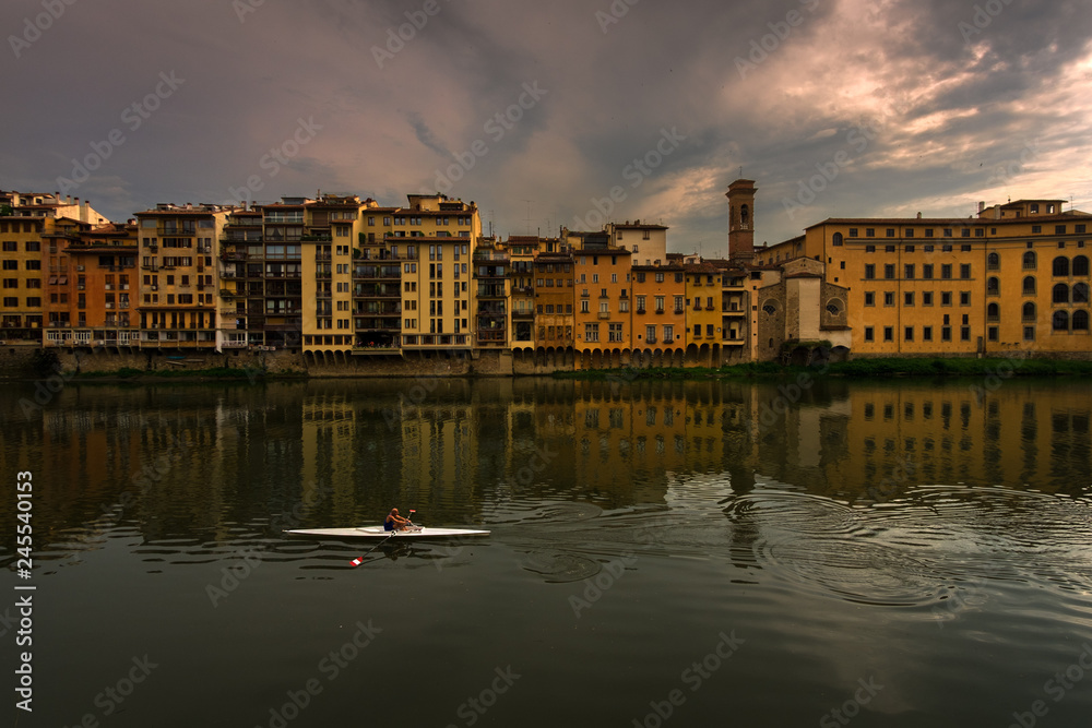 Evening on the Arno River in Florence. City embankments. Italy.