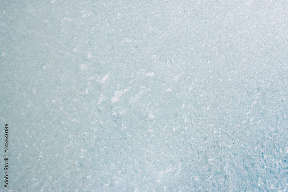 Frozen winter abstract background on the window glass with copy space Frozen winter abstract background on the window glass with copy space
