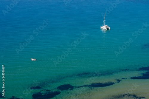 Couple of tourist hire pleasure boats at Arillas on the Greek island of Corfu Greece.