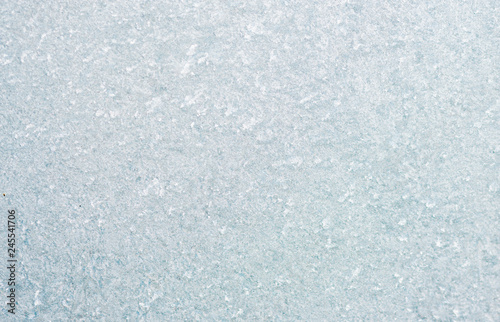 Ice background, frozen water with glass. Winter texture. Copy space.