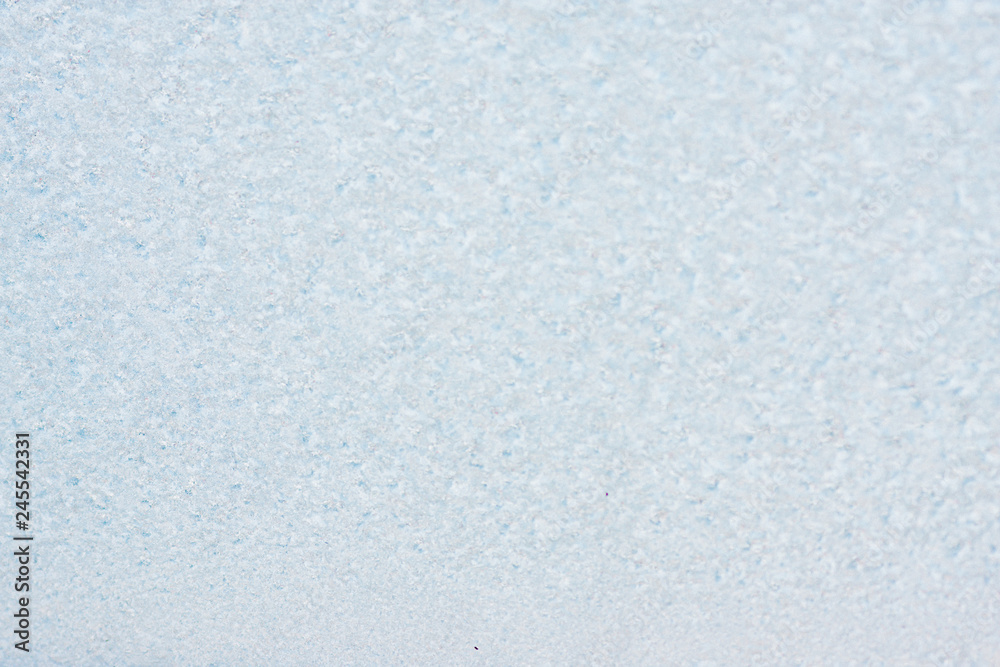 Fototapeta premium Frozen winter abstract background on the window glass with copy space