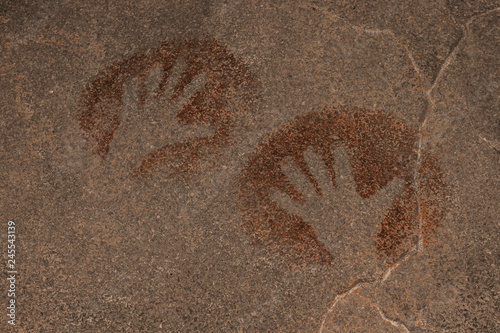 the image of hands on the wall of the cave, painted by ancient man. archaeology.