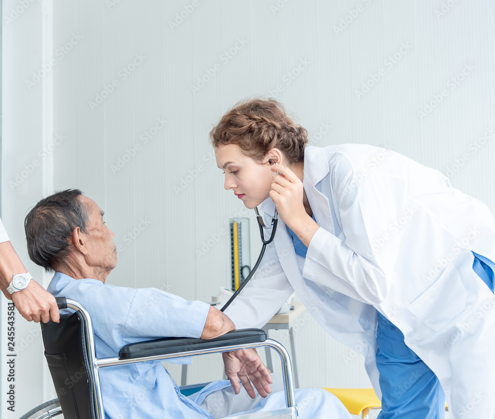 Obraz premium Senior man and doctor helping hands ,explaining diagnosis to his male patient in medical office at hospital/ clinic .Elderly care medicine, age, health care, cardiology and people concept