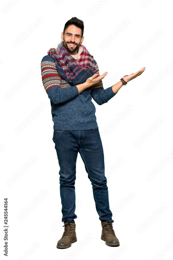Full-length shot of Hippie man extending hands to the side for inviting to come on isolated white background Full-length shot of Hippie man extending hands to the side for inviting to come on isolated white background
