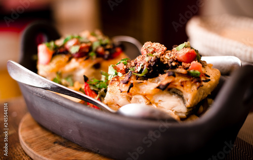 Authentic portuguese food: Delicious soup-like rice with codfish and vegetables