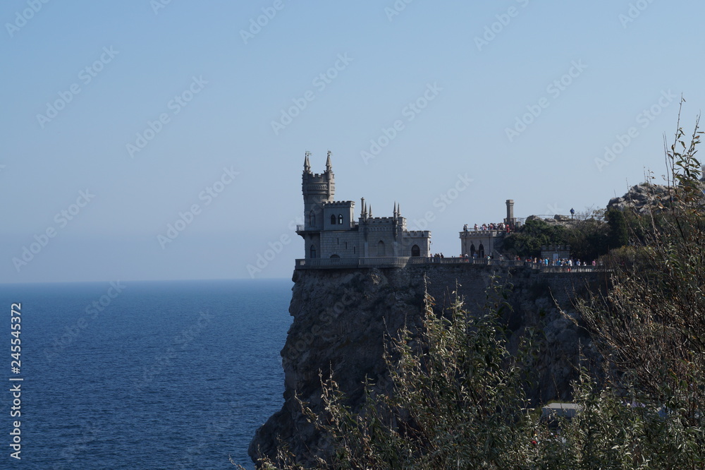 Small castle on the background of the sea