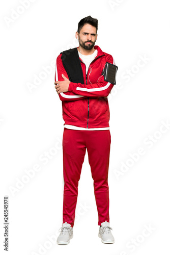 Full-length shot of Handsome sportman feeling upset on isolated white background