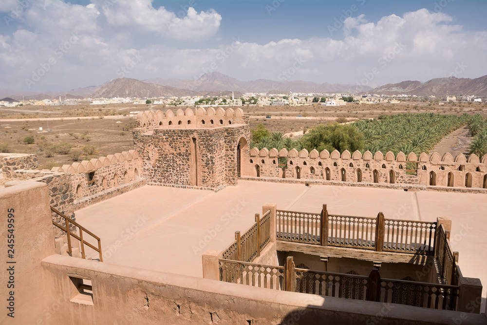 Terrace of the fort of Jabrin and in the background of Bahla and date crops (Oman)