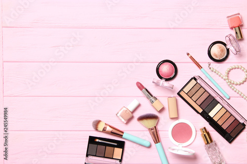  professional makeup tools. Makeup products on wooden background top view. A set of various items for makeup.