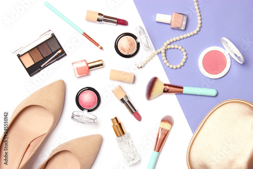  shoes, makeup cosmetics and accessories on a colored background top view.