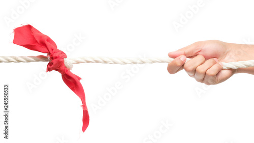 Hands holding rope and pulling. (Tug of war)