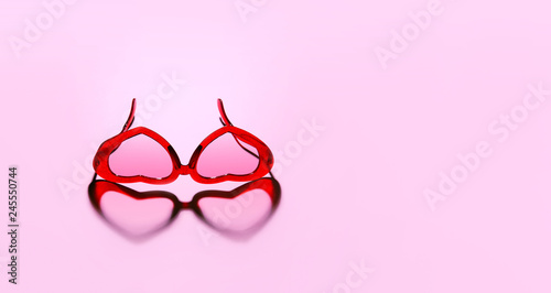 A pair of red heart shaped sun glasses.