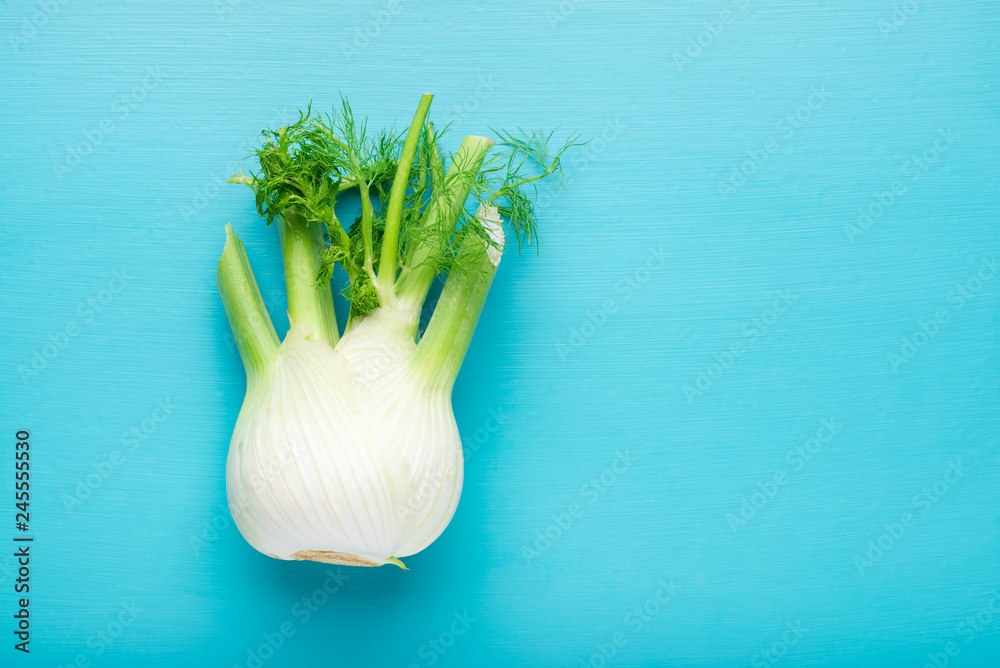 Fresh fennel bulb over blue wooden background, top view - obrazy, fototapety, plakaty 