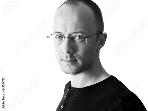 Portrait of young man 30-40 years old of Ukrainian origing, looking at the camera, black and white photography isolated on white. photo