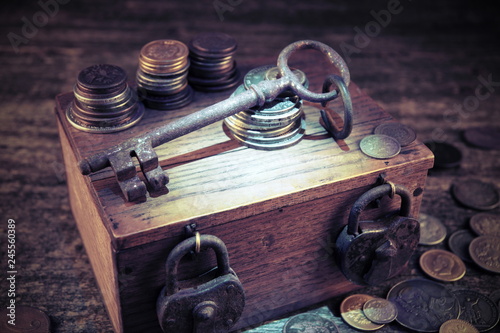 Treasure chest.Padlocks and keys.Old coins and money.Travel and marine engraving background.Pirate map. Vintage style.Treasure searching concept.Gold,silver.Numismatics and collecting money