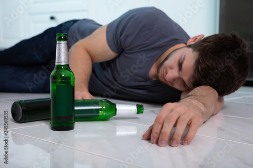 Alcoholic Man Lying On Floor