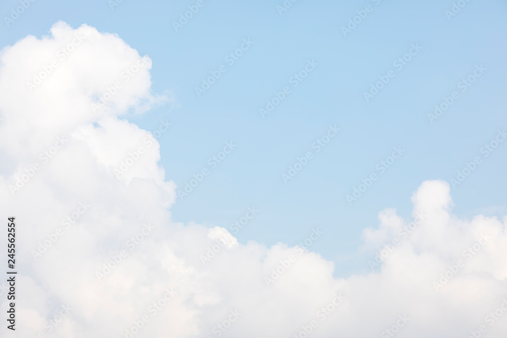 Fototapeta premium Blue sky background and white clouds soft focus, and copy space