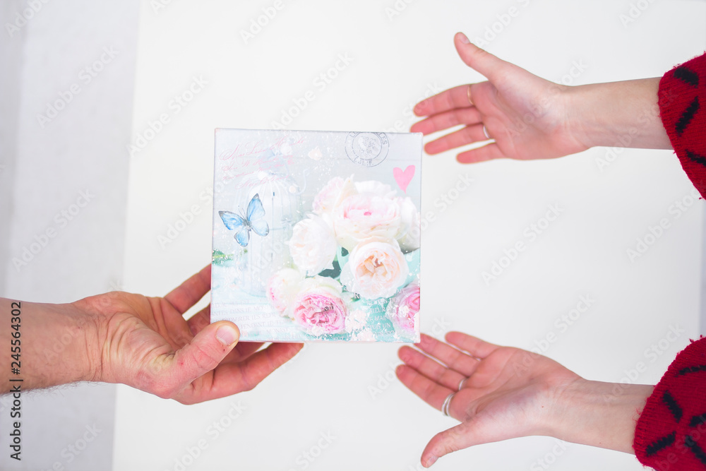 A man gives a woman a gift for Valentine's Day A man gives a woman a gift for Valentine's Day