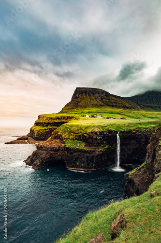 Obraz na płótnie Gasadalur Waterfall at the Faroe Islands in a cloudy day w salonie