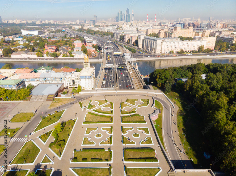 panorama high-rise buildings and transport of metropolis, Frunzenskaya Embankment and the Third Transport Ring, cars on multi-lane highways and road junction in Moscow.